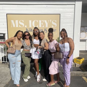 Ms. Icey's Kitchen & Bar - Us in front Ms. Iceys sign - Bars Near Me - Decatur, Georgia
