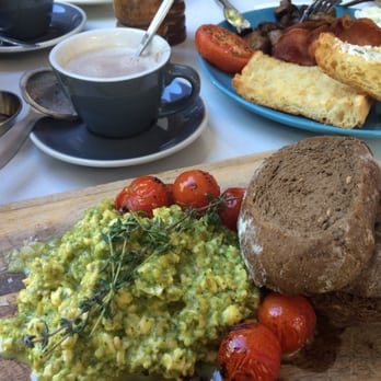 Denim - Green eggs toasts with pesto on the front and Big Breakfast on the back - Cafes Near Me - South Brisbane, QLD