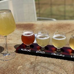 four glasses of wine on a tray four glasses of wine on a tray