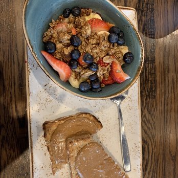 First Watch - House made granola, coconut chia seeds under it with berries, toast, and almond butter - Breakfast & Brunch Near Me - Arvada, Colorado