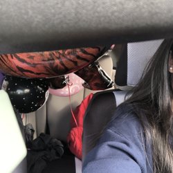 Balloons in da car. (gamer balloon, dinosaur balloon, "it's a girl" balloon and many more not seen.)