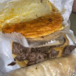 Birria Taco and a plain arrachera quesa taco (we like are tacos plain and we ate some of the meat before we took pic ) Birria Taco and a plain arrachera quesa taco (we like are tacos plain and we ate some of the meat before we took pic )