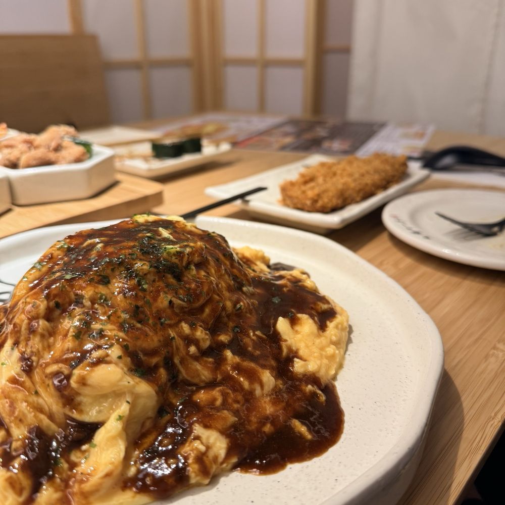 Omurice (after the egg was cut in the middle and poured glazed sauce) Omurice (after the egg was cut in the middle and poured glazed sauce)