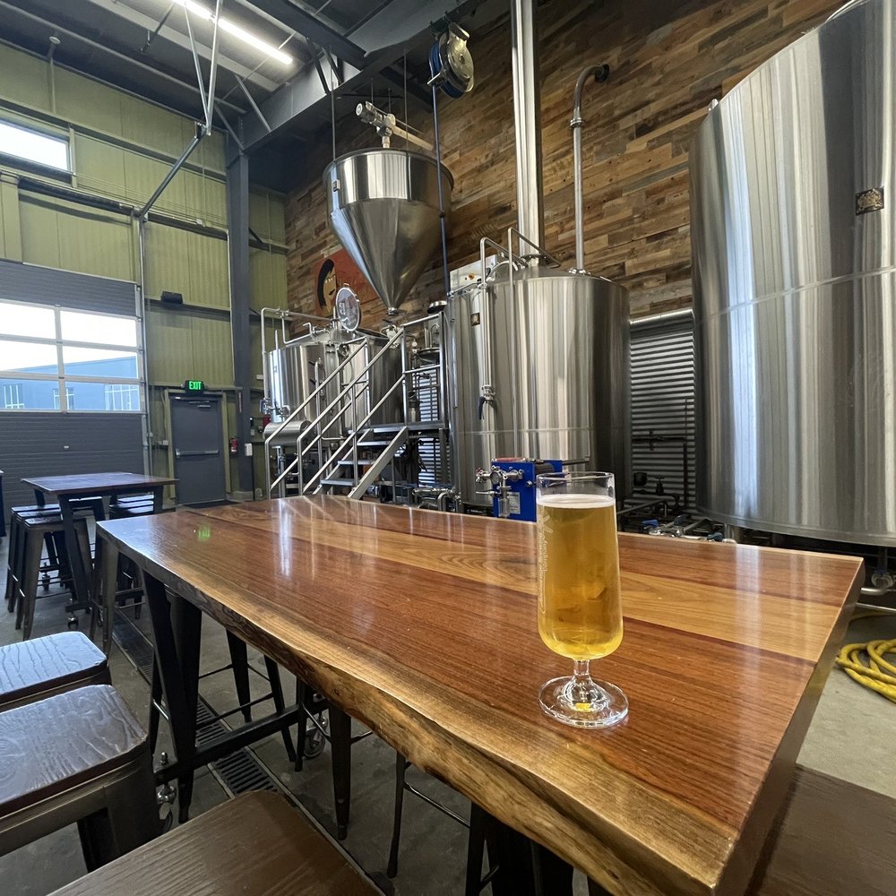 Anchorage Brewing Company - Open seating concept among the brew equipment!  Don't touch it please lol!  I hope they get to keep this format I think it's really neat. - Breweries Near Me - Anchorage, Alaska