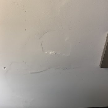 Paris Marriott Opera Ambassador Hotel - Next to the bed light switch is a damaged wall - Hotels Near Me - Paris, 75