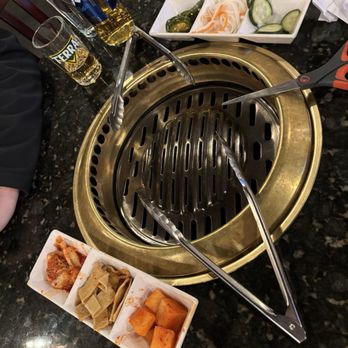 GOGI Korean BBQ - the set up, they're constantly changing the grates. - Korean Near Me - Columbus, Ohio GOGI Korean BBQ - the set up, they're constantly changing the grates. - Korean Near Me - Columbus, Ohio