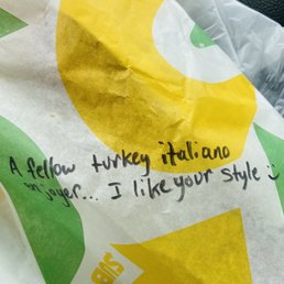 a bag of food with a note on it a bag of food with a note on it