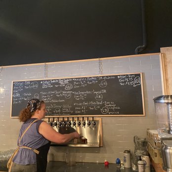 Shippingport Brewing - a woman filling up a beer - Breweries Near Me - Louisville, Kentucky Shippingport Brewing - a woman filling up a beer - Breweries Near Me - Louisville, Kentucky