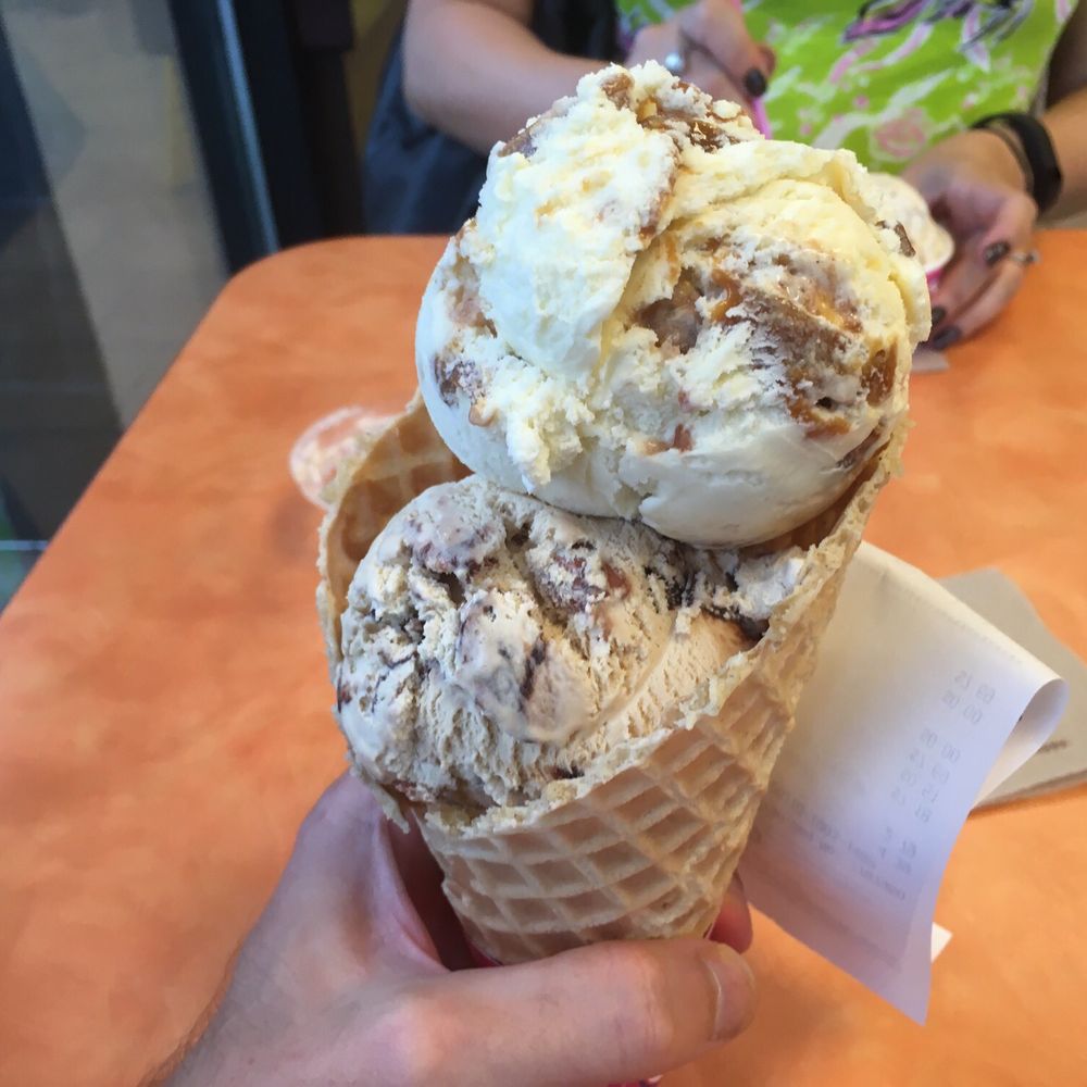 Dunkin' -  a hand holding a cone of ice cream - Donuts Near Me - Auburndale, Florida