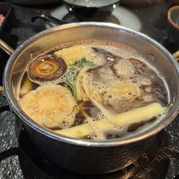 Ichi Shabu - My first ingredients. Corn, mushrooms, zucchini, bok choy, and below that a couple slices of yellowtail. - Japanese Near Me - Fresno, California
