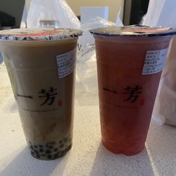 YiFang Taiwan Fruit Tea - Brown sugar oat milk tea is on the left and the strawberry tea with pearls is on the right.