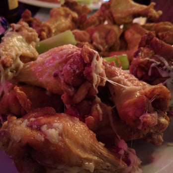 Whiskey Warehouse - Wings. Garlic Parmesan up front, Lemon Pepper over yonder. Not pictured but oh so finger licking delicious is the Honey BBQ wings. - Pubs Near Me - Charlotte, North Carolina