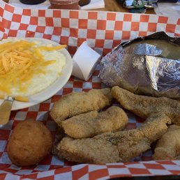 Fried catfish lunch special with cheese grits and baked potato