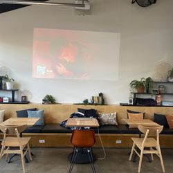 Seating area with music, movies on the wall, game nights