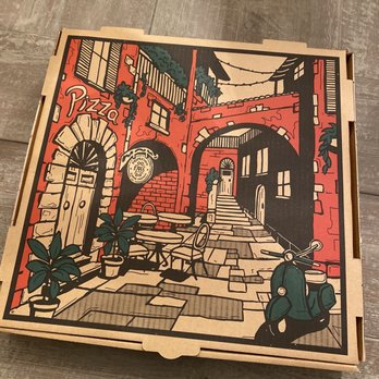 Big Ed's Pizza - a pizza box on a wooden table - Pizza Near Me - Huntsville, Alabama Big Ed's Pizza - a pizza box on a wooden table - Pizza Near Me - Huntsville, Alabama
