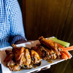 The Tavern on Broad - Wings cooked duck confit with your choice of The Tavern special sauce blends.
