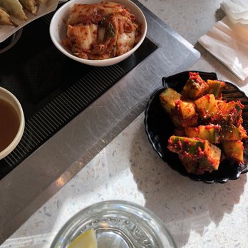 Korean Restaurant - The kimchi dishes. These are the small portions. Oh and you see the mandu. My son prefers the steamed ones aka won't share. - Korean Near Me - Grafenwöhr, BY Korean Restaurant - The kimchi dishes. These are the small portions. Oh and you see the mandu. My son prefers the steamed ones aka won't share. - Korean Near Me - Grafenwöhr, BY