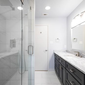 Purple Renovations - a large bathroom with a walk in shower - General Contractors Near Me Purple Renovations - a large bathroom with a walk in shower - General Contractors Near Me