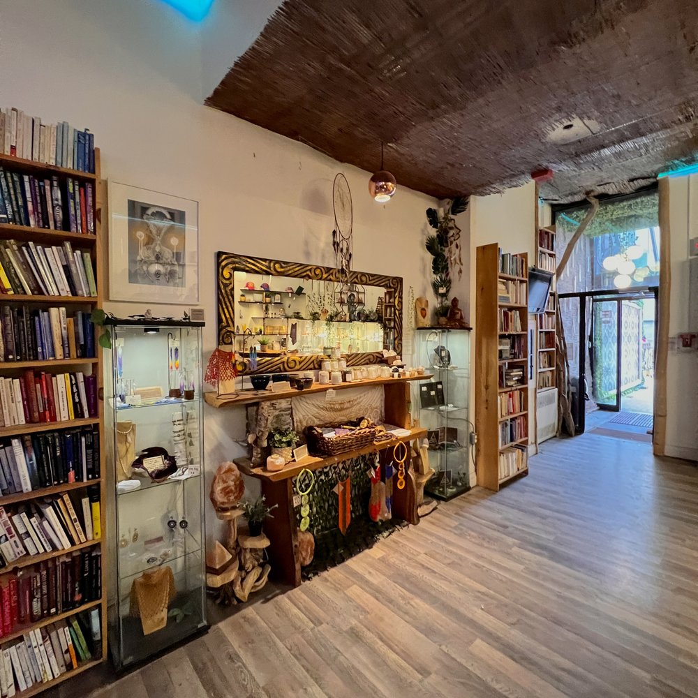 Alternity - a room with bookshelves and shelves - Lounges Near Me - Toronto, Ontario