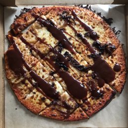 A burned BBQ Bacon Pizza. A burned BBQ Bacon Pizza.