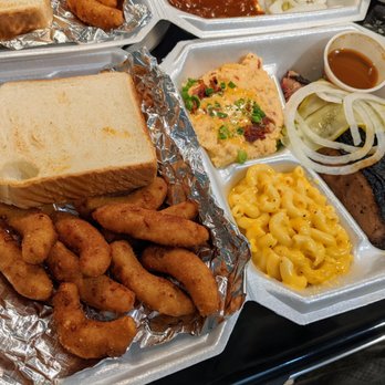 The Original Q Shack - Chili-rubbed beef brisket slice plate with jalapeno cheddar grits, mac & cheese. $15.95. Includes bread, hush puppies, pickles and onions. - Barbeque Near Me - Durham, North Carolina The Original Q Shack - Chili-rubbed beef brisket slice plate with jalapeno cheddar grits, mac & cheese. $15.95. Includes bread, hush puppies, pickles and onions. - Barbeque Near Me - Durham, North Carolina