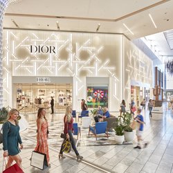 Shoppers walk past Dior and Bottega Veneta in Crystal Court at Scottsdale Fashion Square.