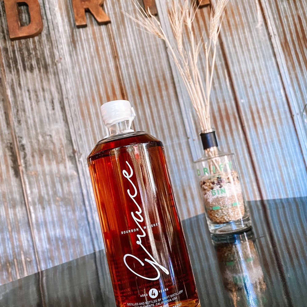 Drift Distillery - a bottle of whiskey next to a reed - Distilleries Near Me - San Clemente, California Drift Distillery - a bottle of whiskey next to a reed - Distilleries Near Me - San Clemente, California
