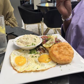 Katch Kitchen & Cocktails - Brunch:Blackened Salmon, creamy grits, eggs sunny side up with the absolute best God smiled upon biscuits in this world! - Bars Near Me - Tucker, Georgia Katch Kitchen & Cocktails - Brunch:Blackened Salmon, creamy grits, eggs sunny side up with the absolute best God smiled upon biscuits in this world! - Bars Near Me - Tucker, Georgia