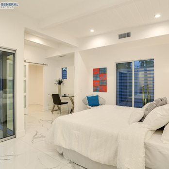 Ringo General Contracting - a bedroom with a large bed - General Contractors Near Me