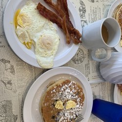 Little House Of Pancakes - Blueberry pancakes, 2 eggs over medium and bacon.