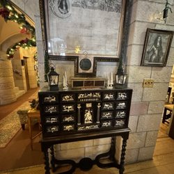 Cherokee Ranch & Castle - An ancient apothecary chest made of ebony with inlaid ivory. Above is the original pardon of King George II