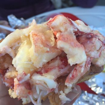 Red's Eats - Half-eaten lobster roll - Seafood Near Me - Wiscasset, Maine