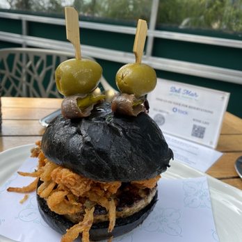 Del Mar - chorizo and fried calamari with squid ink brioche buns - Spanish Near Me - Washington, DC, District of Columbia