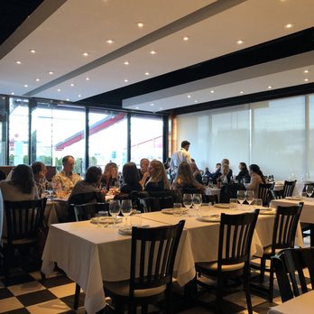 Bottega - people sitting at tables in a restaurant - Pizza Near Me - Laval, Quebec