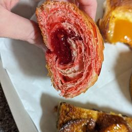 Cross section of the strawberry croissant (filled with jam). Cross section of the strawberry croissant (filled with jam).