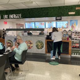 people eating at a restaurant counter