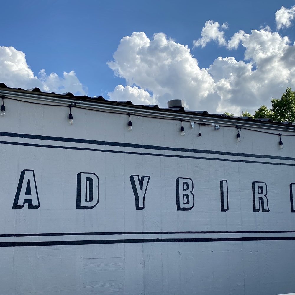 Ladybird's - a sign on the side of a building - Cocktail Bars Near Me - Houston, Texas Ladybird's - a sign on the side of a building - Cocktail Bars Near Me - Houston, Texas