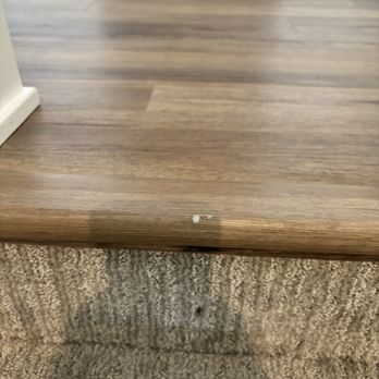 Rxo - Chipped LVP that they dragged the tread box on. They dragged it all the way down the stairs. The stairs are also dirty and soiled. - Shipping Centers Near Me - Walker, Michigan