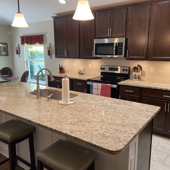 Noble Granite - a kitchen island with stools - Countertop Installation Near Me - Jacksonville, Florida