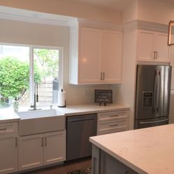 Diamond Custom Cabinetry - Riviera stile white kitchen and gray island by Diamond Custom Cabinetry