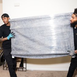 The Movers Moving - Fully wrapped dresser.
