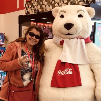Winn-Dixie - a woman standing next to a giant teddy bear - Grocery Near Me - Panama City, Florida Winn-Dixie - a woman standing next to a giant teddy bear - Grocery Near Me - Panama City, Florida