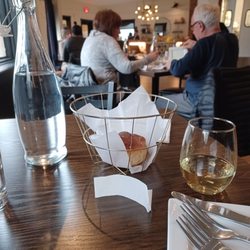 Bread roll and glass of villa sparing Gavin white wine