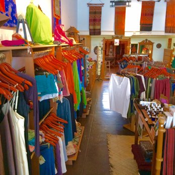 Perfect Harmony - a woman browses for clothing in a store - Tea Rooms Near Me - Hilo, Hawaii