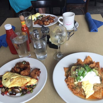Azul 18 - Clockwise from bottom left - the chilaquiles, the garbage omelet, and the eggs benedict. - New American Near Me - Chicago, Illinois