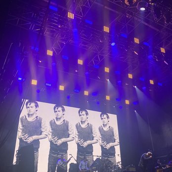 Riot Fest Chicago - Young Morrissey (in the backdrop) and older Morrissey on stage at Riot Fest 2021. - Festivals Near Me - Chicago, Illinois