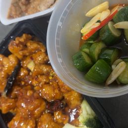 Orange chicken, fried pork chop appetizer, cucumber salad! Orange chicken, fried pork chop appetizer, cucumber salad!