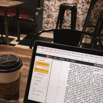 Brewed Cafe & Pub - a laptop on a table - Coffee & Tea Near Me - Vancouver, Washington