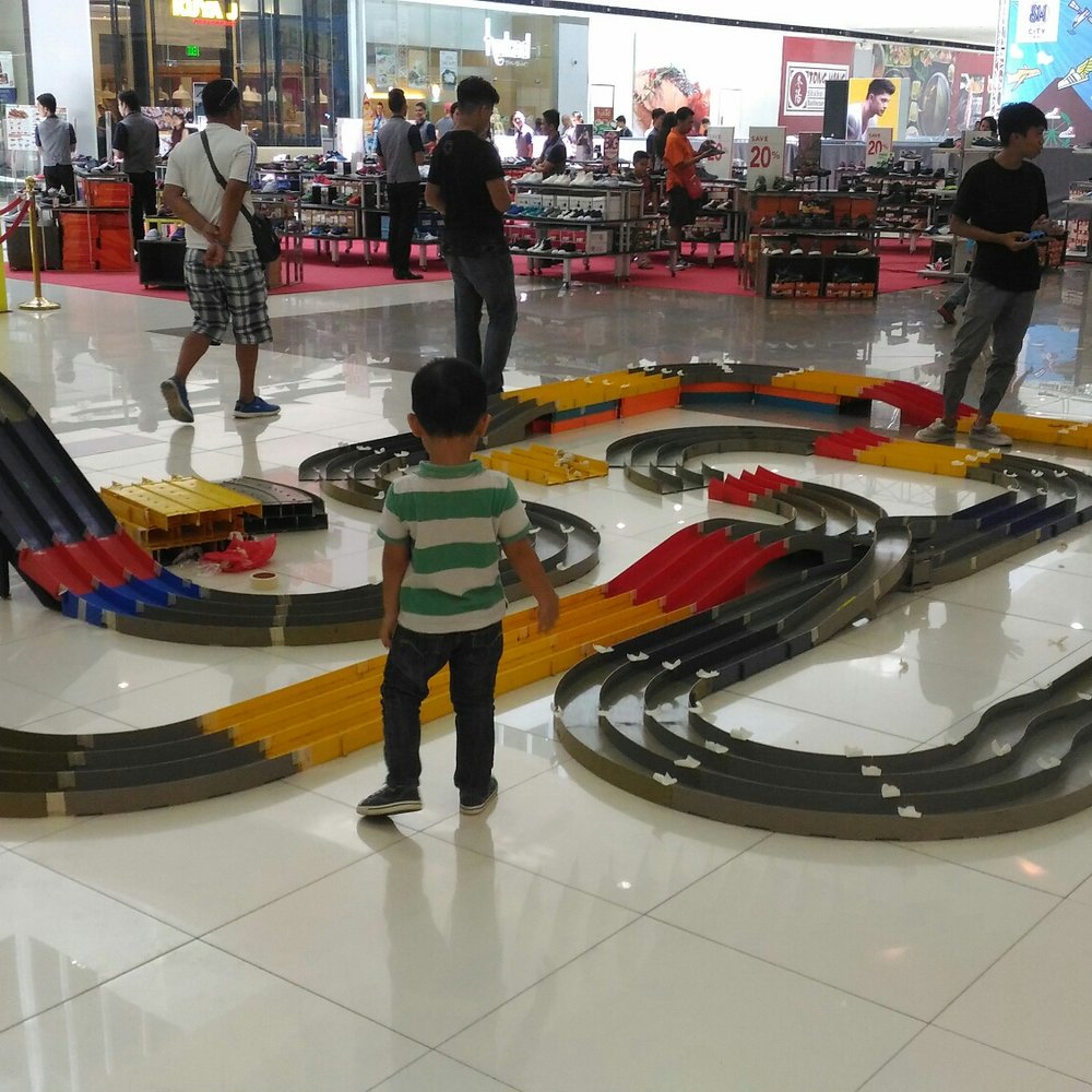 SM City - Setting up the mini car track - Shopping Centers Near Me - Davao City, DAS