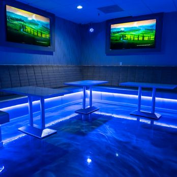 Elevation Lounge - a view of a pool with a tv in the background - Lounges Near Me - Jacksonville, Florida Elevation Lounge - a view of a pool with a tv in the background - Lounges Near Me - Jacksonville, Florida